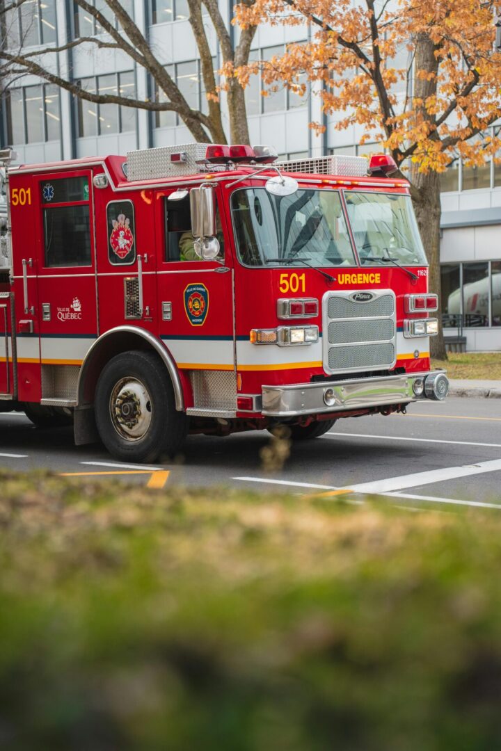 A fire truck is driving down the street.