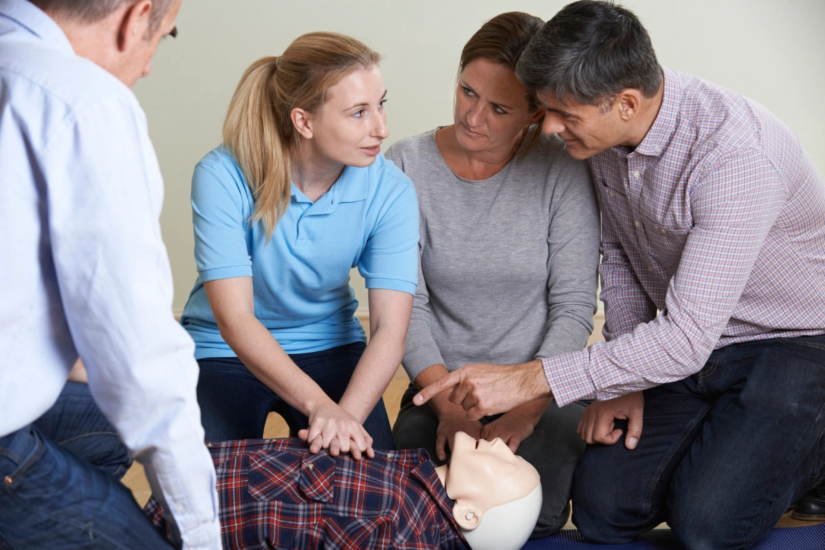 CPR training class with a mannequin.