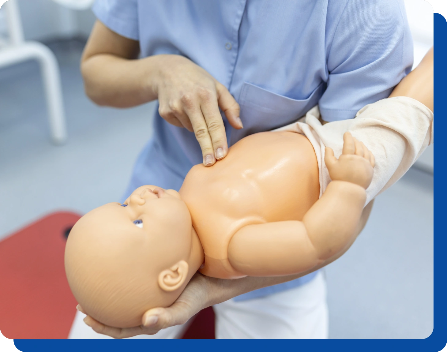 Infant CPR training dummy demonstration.