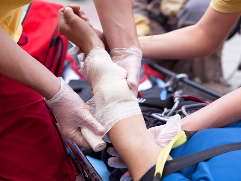 First aid: Bandaging a wrist injury.