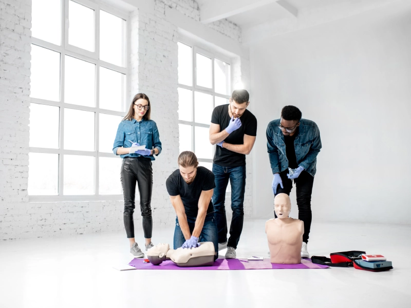 CPR training class with mannequins.