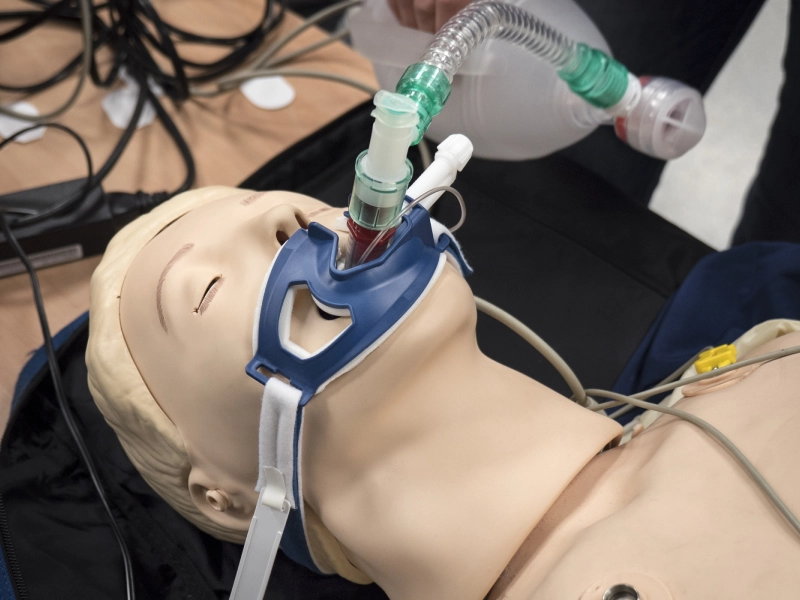 Medical mannequin with airway device.