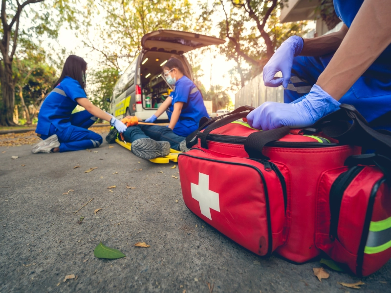 Paramedics tending to injured person.